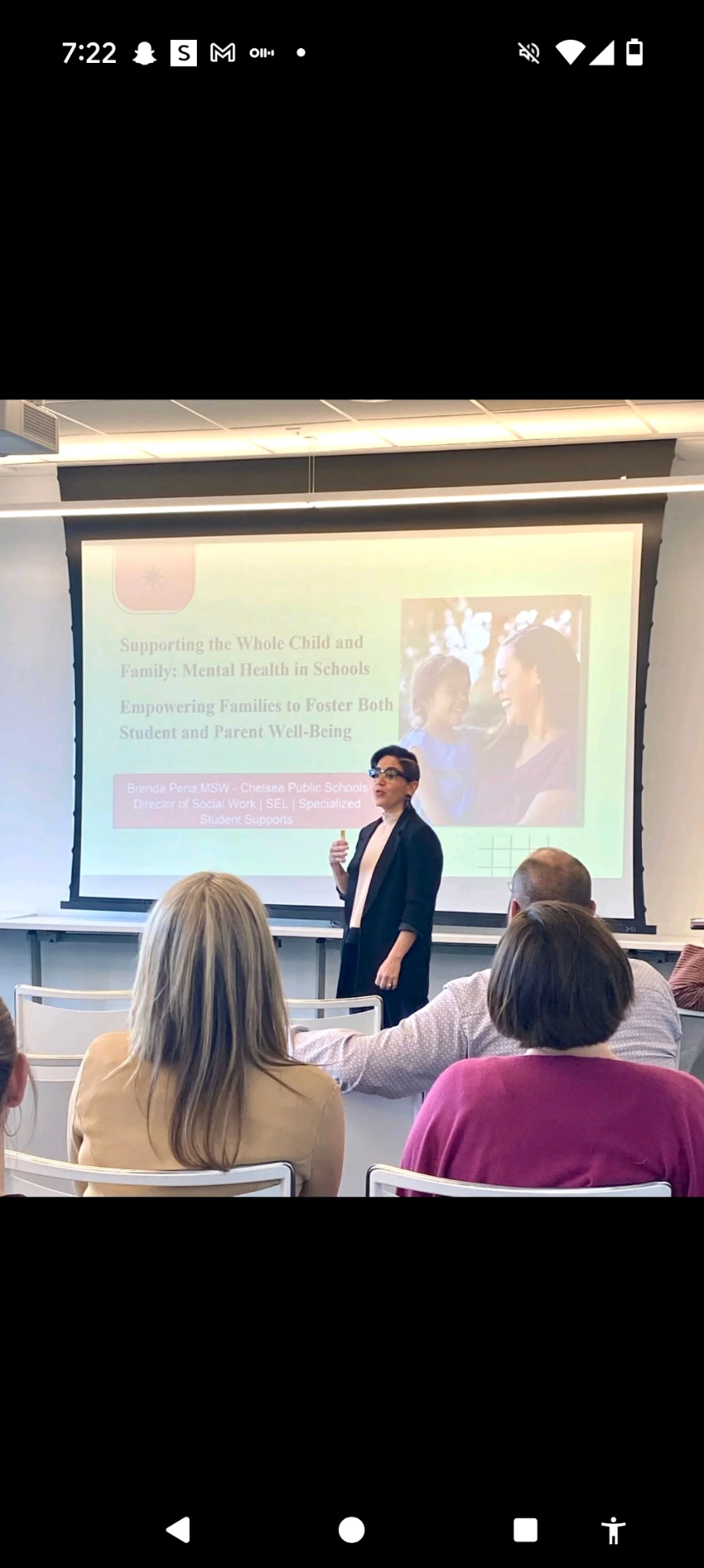 Brenda Ortiz McGrath presenting on student and family mental health in schools to an audience of educators.